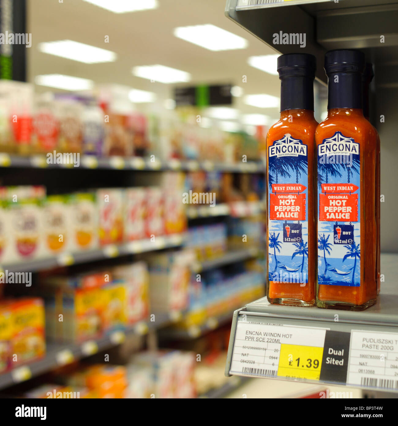 bottle-of-encona-hot-pepper-sauce-on-a-shelf-at-co-op-supermarket-BP3T4W.jpg